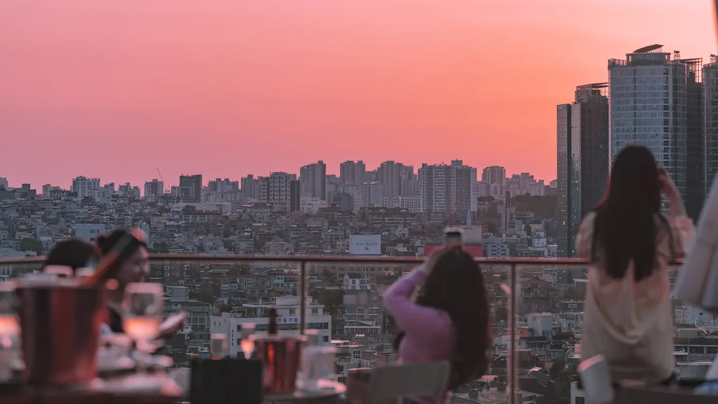 A rooftop table overlooking the Las Vegas Strip at sunset