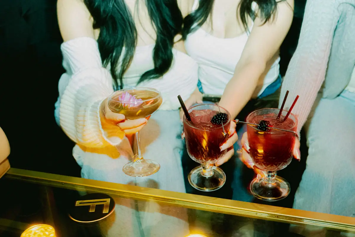 A velvet-lined cocktail lounge with low, warm lighting